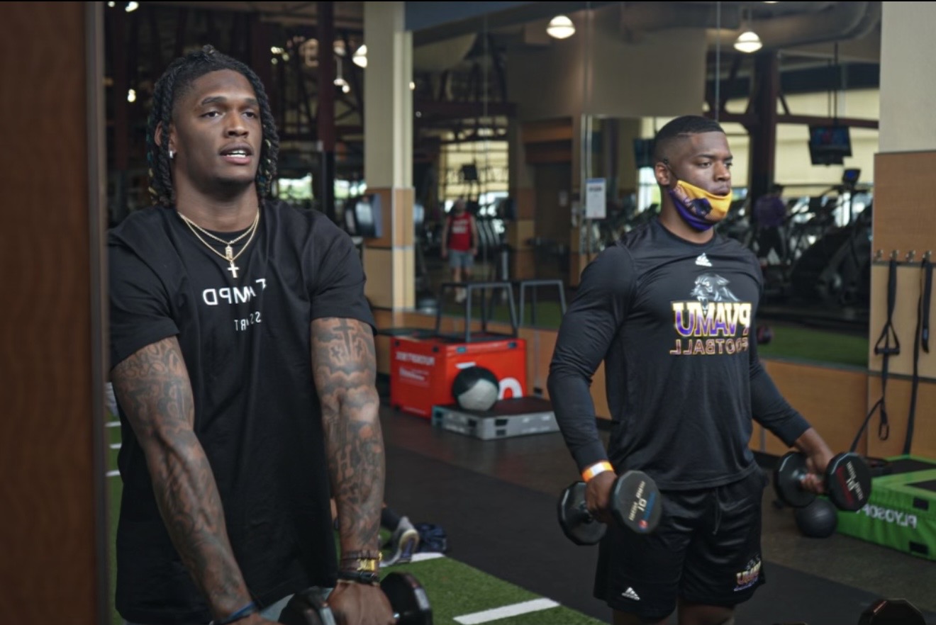 Coach Q training alongside a high-level professional athlete
